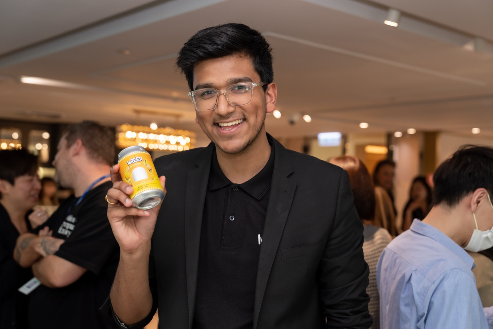 Naman Tekriwal holding a Breer can at an event in Hong Kong